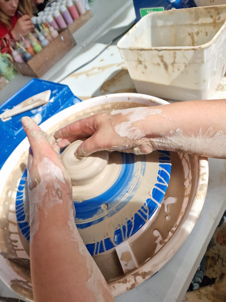 Clay being crafted on a potters wheel